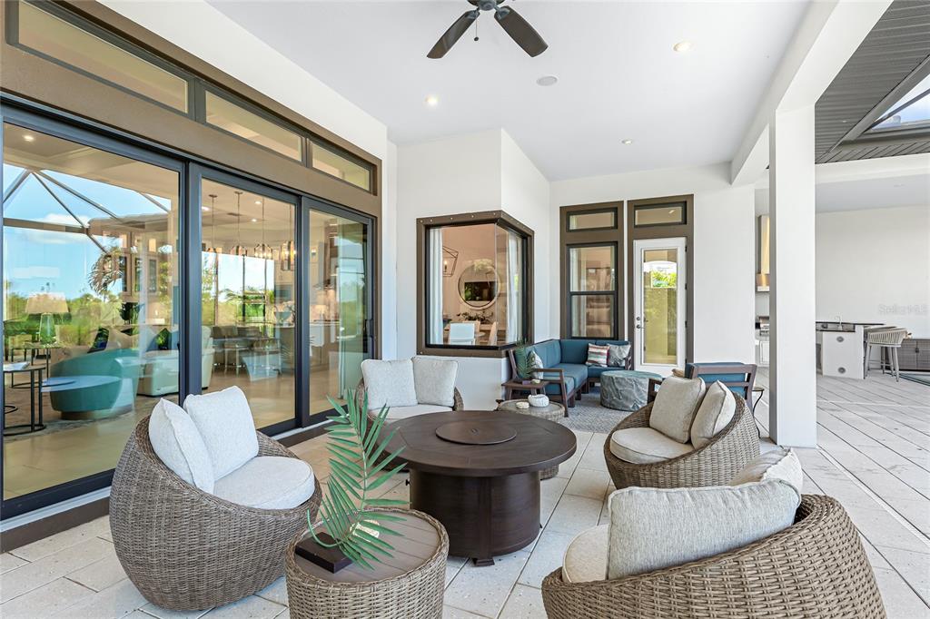 8232 Summer Night Road Sarasota, FL 34241 - Photo 38 of 82 a living room with patio furniture and a large window