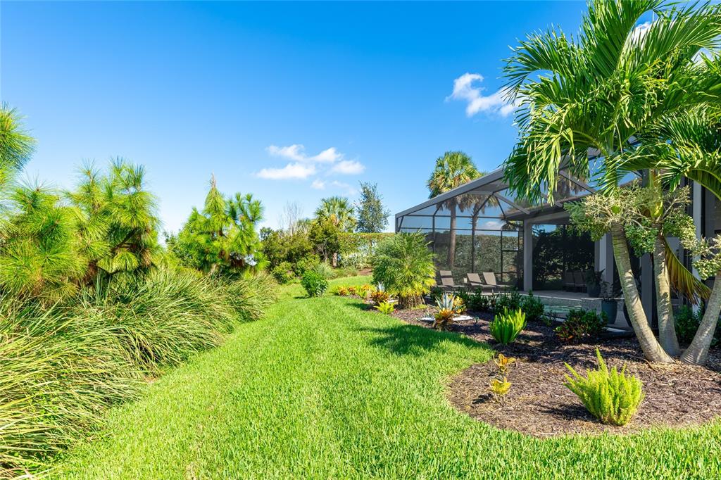 8232 Summer Night Road Sarasota, FL 34241 - Photo 45 of 82 a view of a house with backyard outdoor seating and hardwood