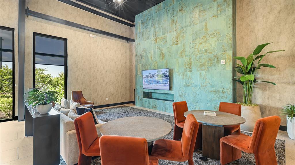 8232 Summer Night Road Sarasota, FL 34241 - Photo 56 of 82 a dining room with furniture and a potted plant