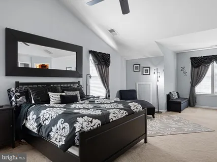 a bedroom with bed and window