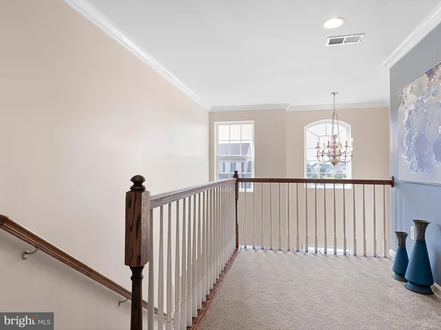 a view of a hallway with windows