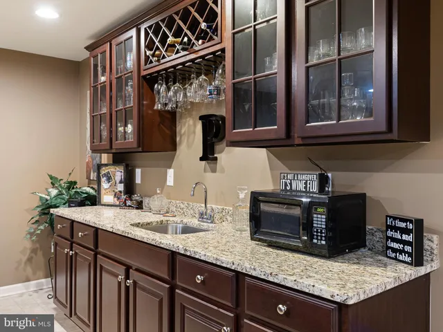 a kitchen with a sink and a microwave