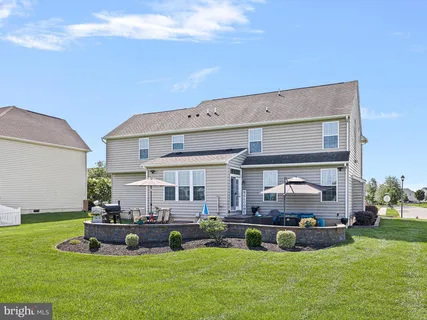 a view of an house with backyard porch and sitting area