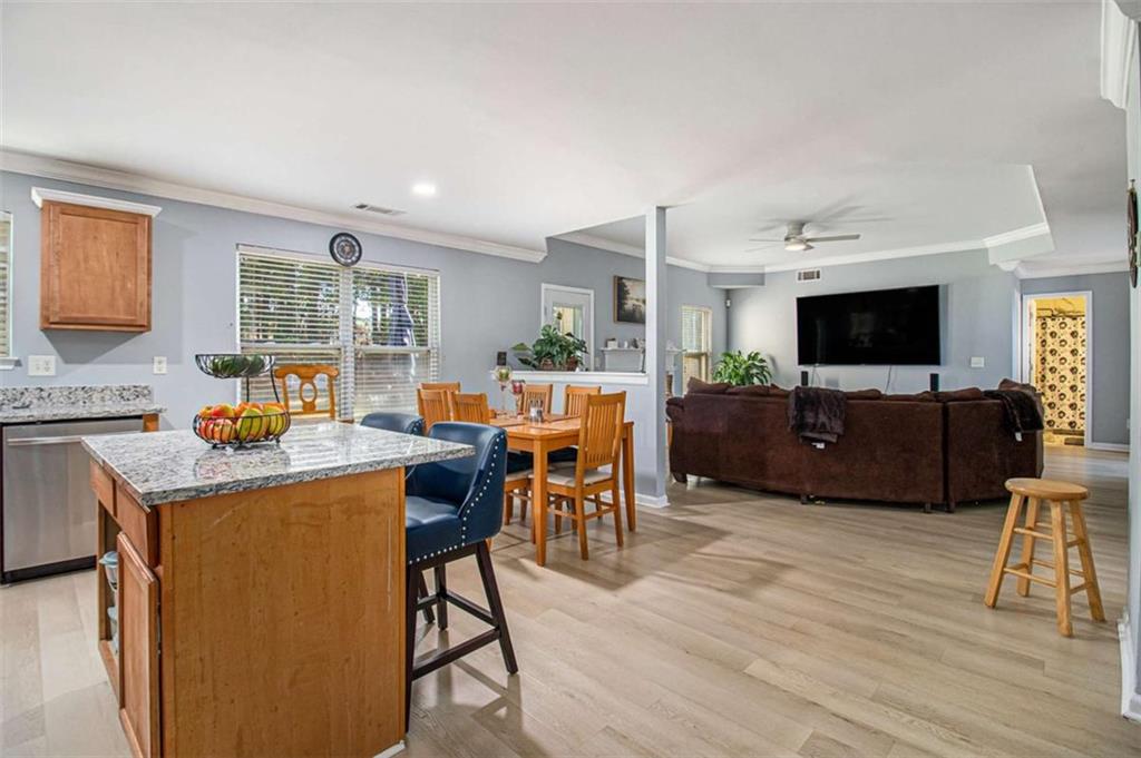 550 Windsor Way Fairburn, GA 30213 - Photo 12 of 28 a living room with furniture and a flat screen tv