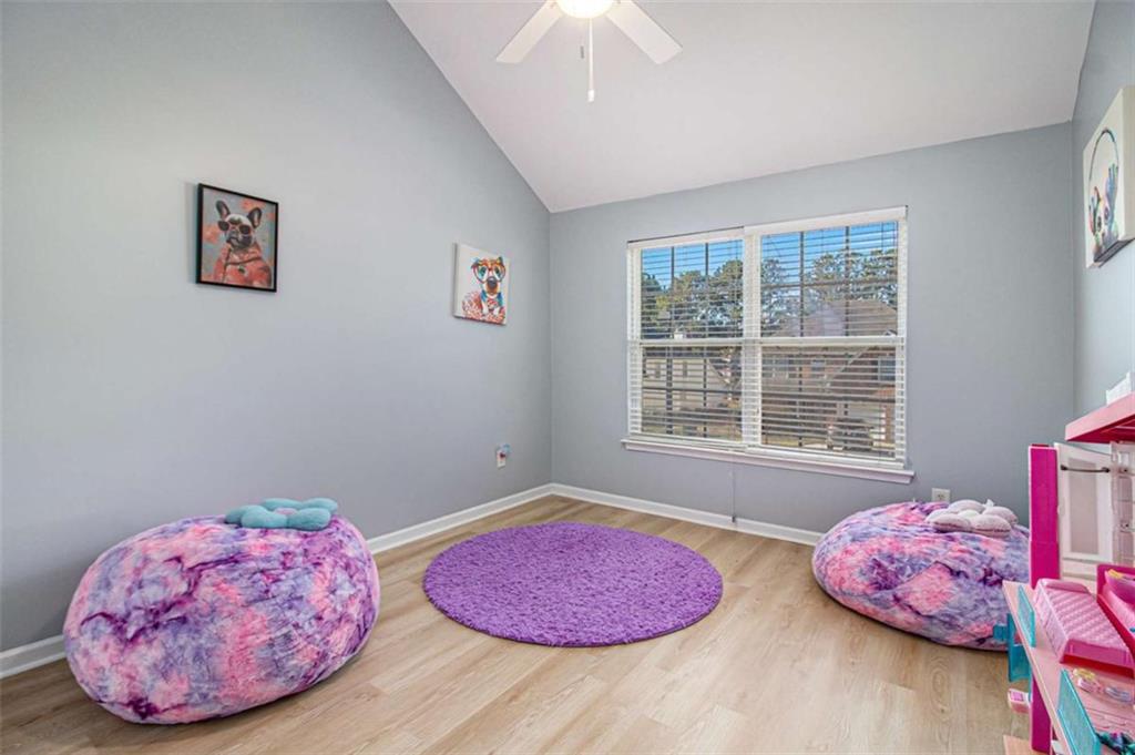 550 Windsor Way Fairburn, GA 30213 - Photo 21 of 28 a bedroom with a bed and a window