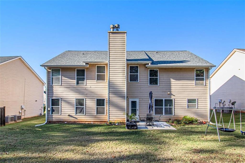 550 Windsor Way Fairburn, GA 30213 - Photo 25 of 28 a front view of a house with a garden