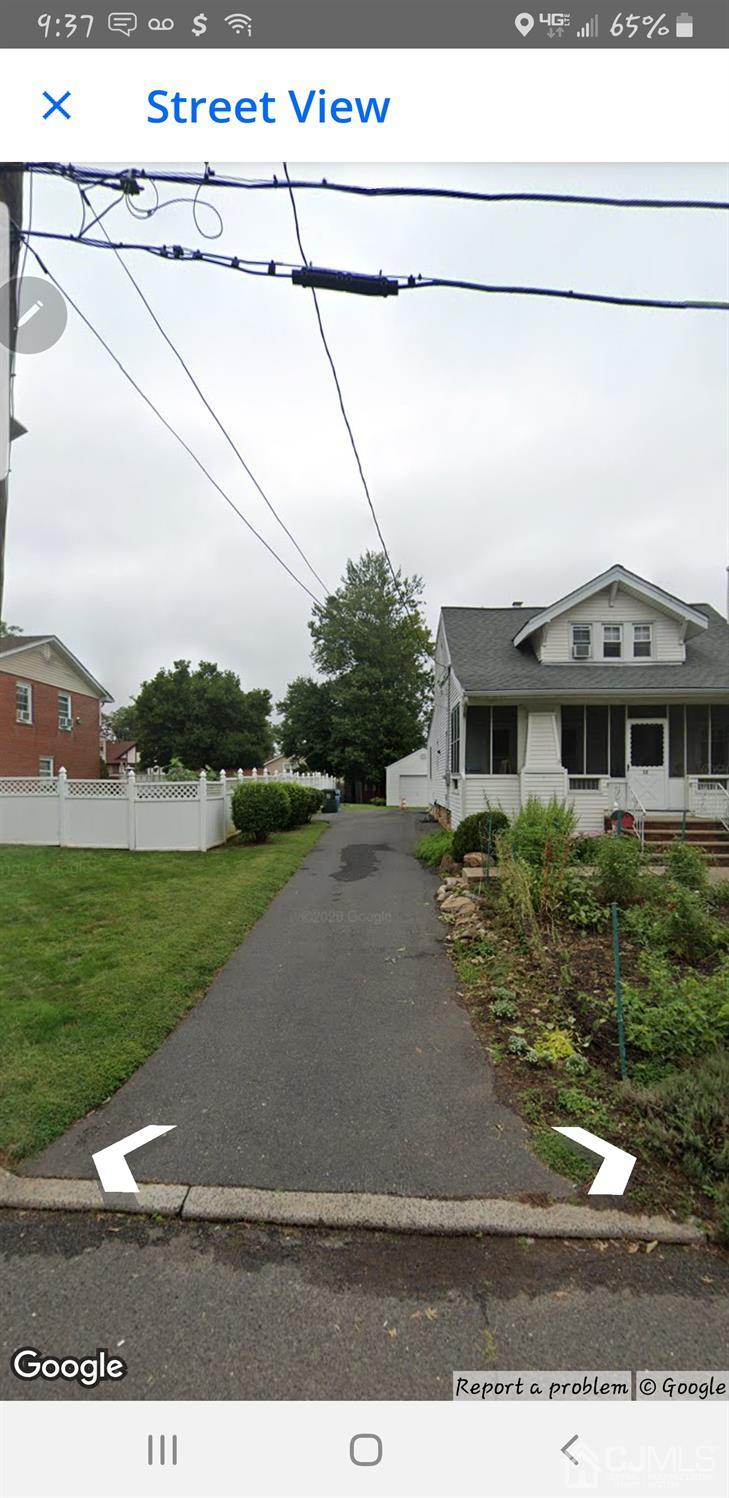 12 West Hill Road Colonia, NJ 07067 - Photo 1 of 1 a front view of a house with a yard