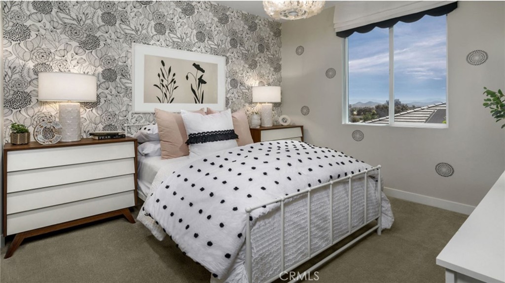 2395 Huron Road Rialto, CA 92377 - Photo 11 of 17 a bedroom with a bed and window