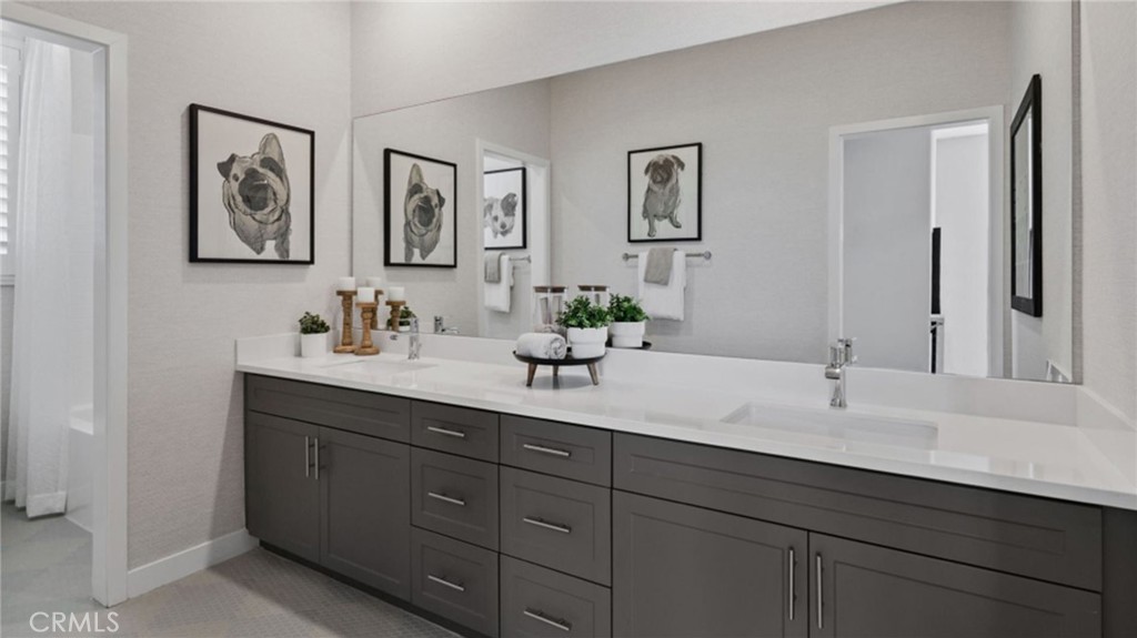 2395 Huron Road Rialto, CA 92377 - Photo 12 of 17 a bathroom with double sink and a mirror