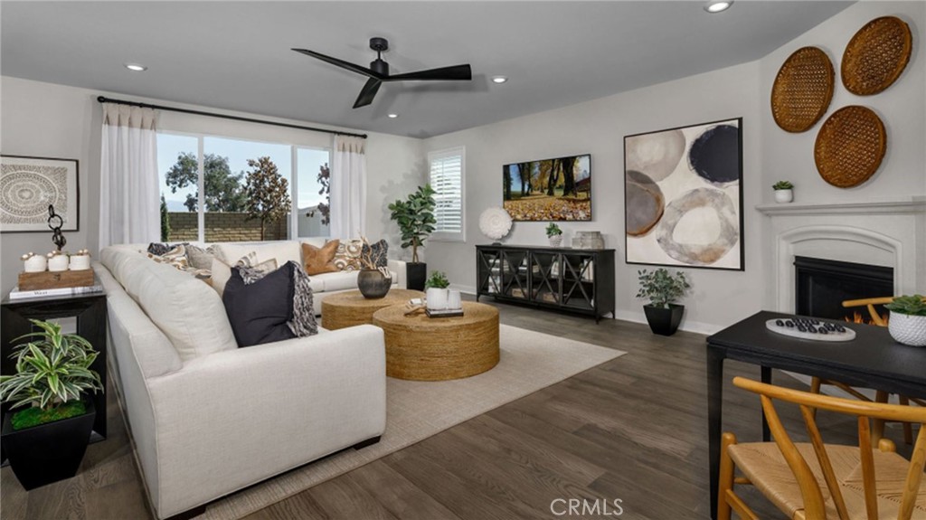 2395 Huron Road Rialto, CA 92377 - Photo 2 of 17 a living room with furniture and a fireplace