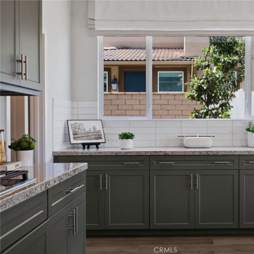2395 Huron Road Rialto, CA 92377 - Photo 4 of 17 a kitchen with a sink and cabinets