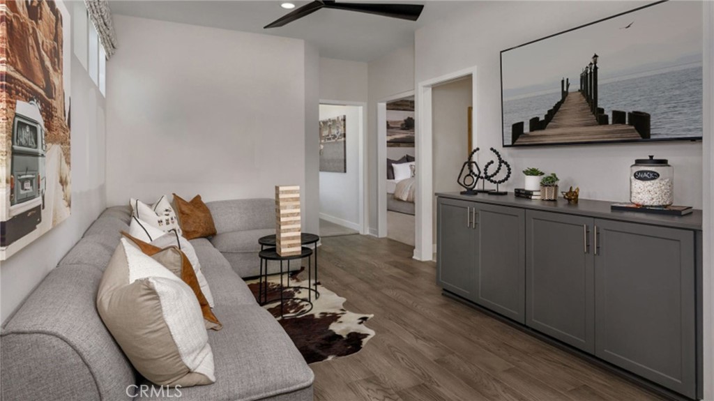 2395 Huron Road Rialto, CA 92377 - Photo 7 of 17 a living room with hard wood flooring and furniture