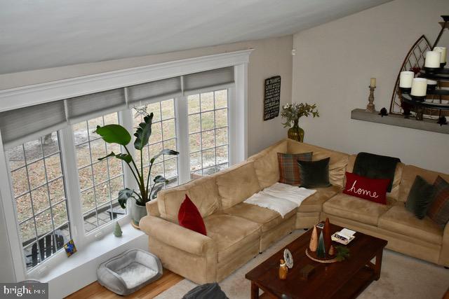 9203 Burbank Road Philadelphia, PA 19115 - Photo 22 of 62 a living room with furniture hard wood floor and a potted plant