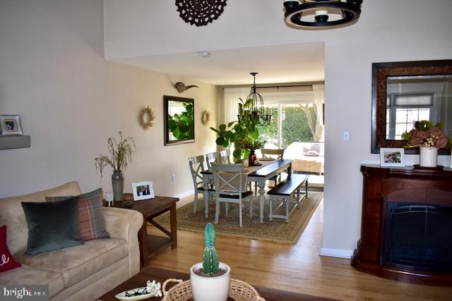 9203 Burbank Road Philadelphia, PA 19115 - Photo 26 of 62 a living room with couches chairs and a potted plant with wooden floor