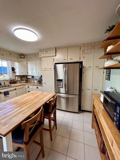 9203 Burbank Road Philadelphia, PA 19115 - Photo 28 of 62 a kitchen with stainless steel appliances a refrigerator a stove a sink and a refrigerator