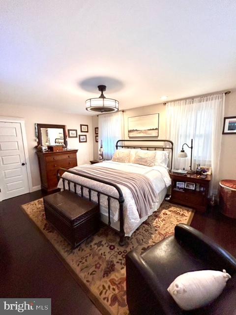 9203 Burbank Road Philadelphia, PA 19115 - Photo 44 of 62 a bedroom with a bed and wooden floor