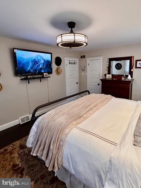 9203 Burbank Road Philadelphia, PA 19115 - Photo 47 of 62 a bedroom with a large bed and a chandelier