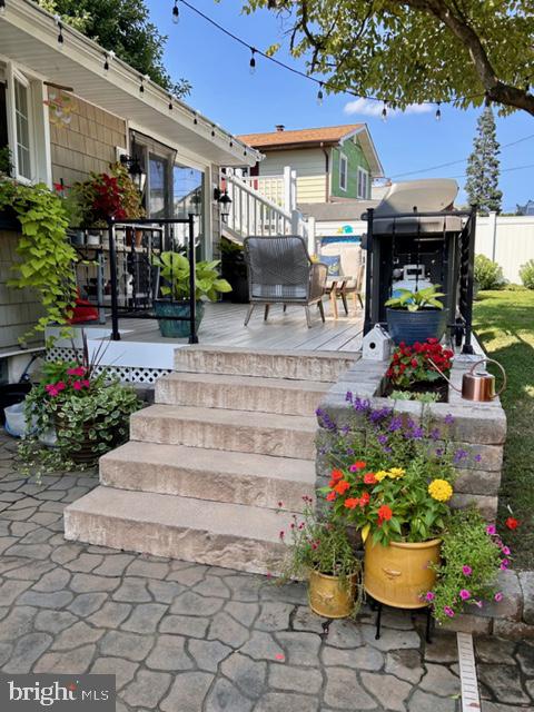 9203 Burbank Road Philadelphia, PA 19115 - Photo 51 of 62 a view of a patio with table and chairs potted plants