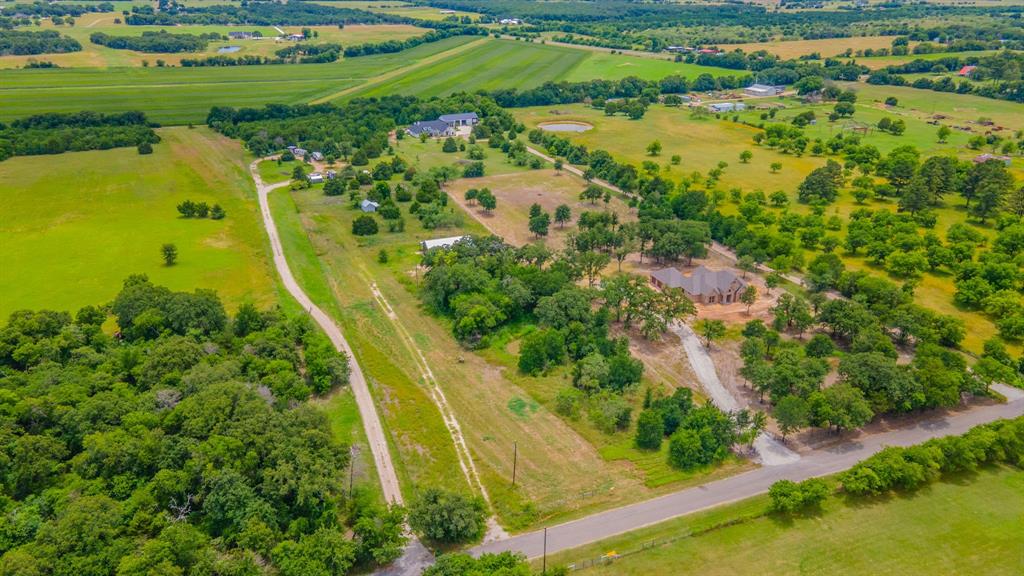 Tbd Wiggins Road West, TX 76691 - Photo 6 of 11 Expansive aerial view showcasing a large residential property surrounded by mature trees and verdant fields