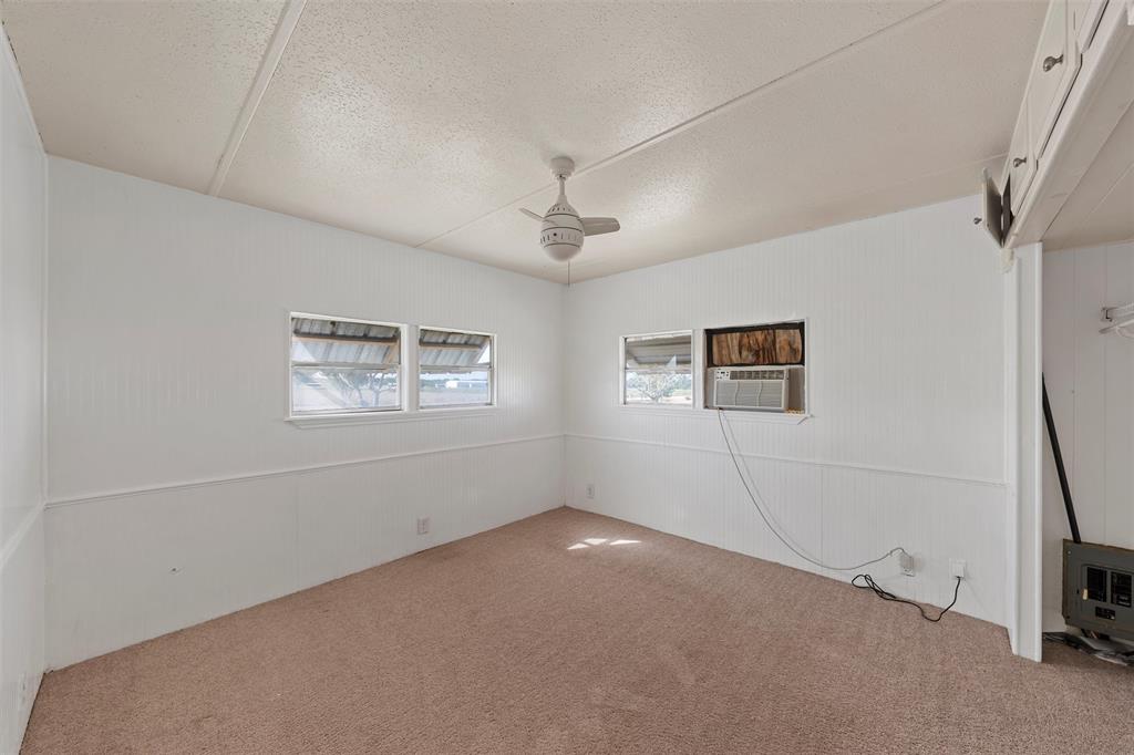 315 Winter Hawk McGregor, TX 76657 - Photo 11 of 15 a view of a hallway with a ceiling fan