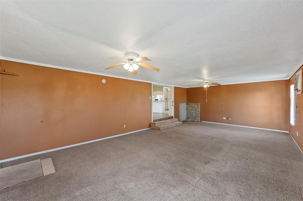 315 Winter Hawk McGregor, TX 76657 - Photo 5 of 15 a view of an empty room with a chandelier fan