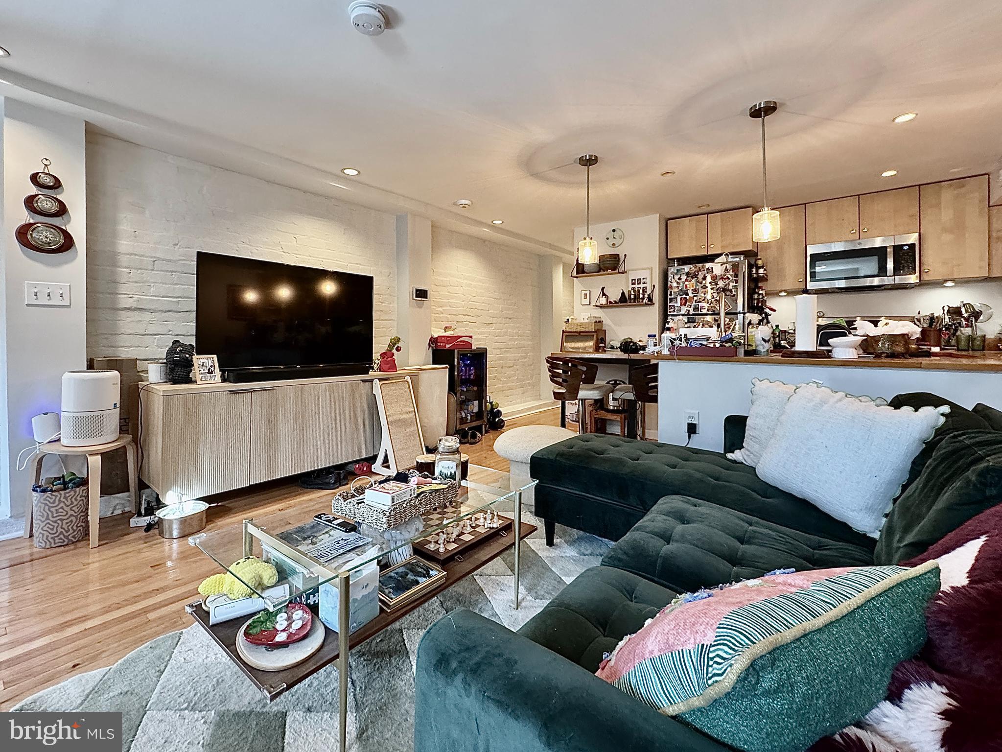 2017 13th Street Northwest, Unit B Washington, DC 20009 - Photo 5 of 15 a living room with furniture and a flat screen tv