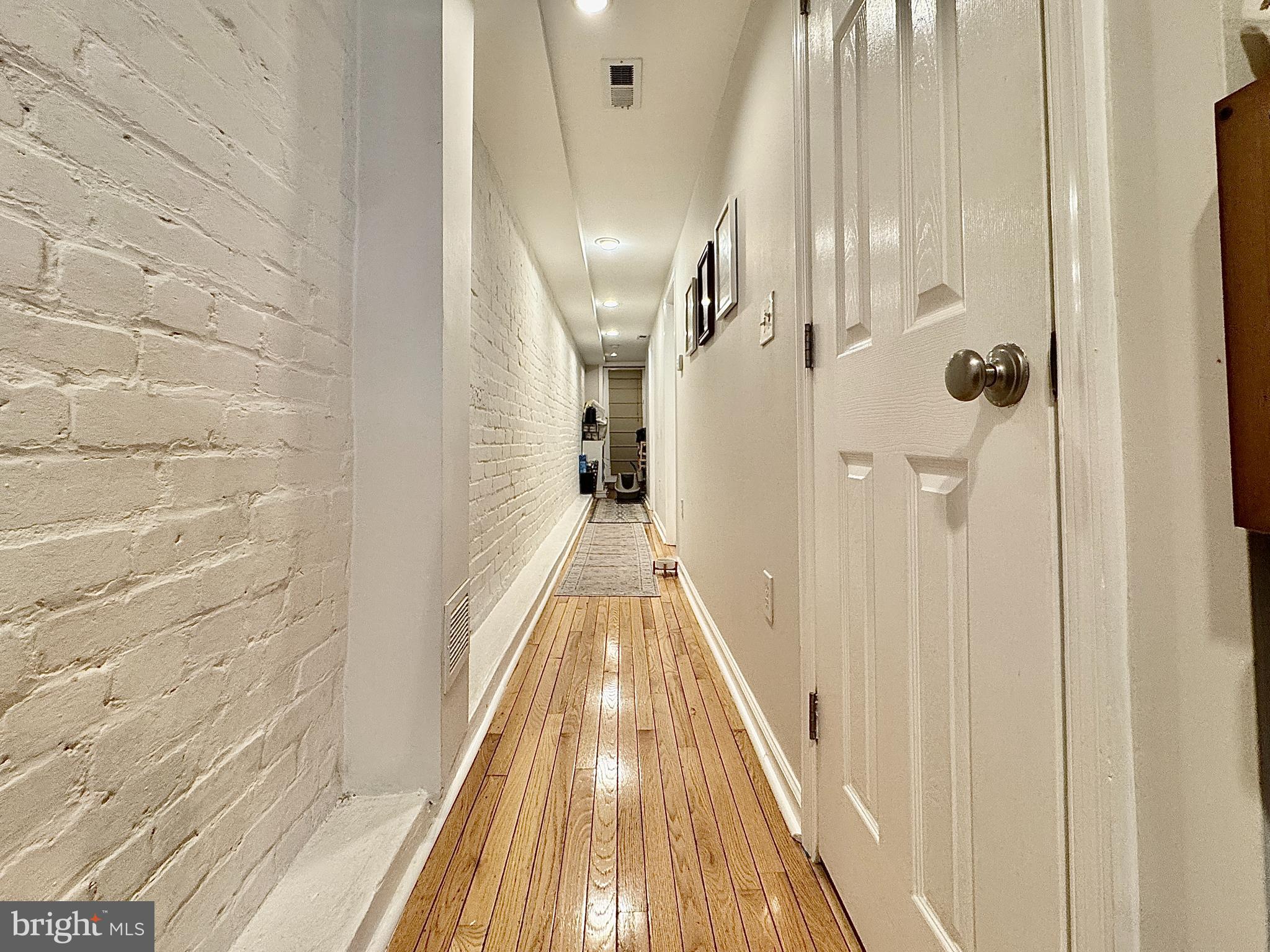 2017 13th Street Northwest, Unit B Washington, DC 20009 - Photo 8 of 15 a view of a hallway with wooden floor