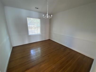 1915 13th Street Columbus, GA 31906 - Photo 4 of 5 an empty room with wooden floor and windows