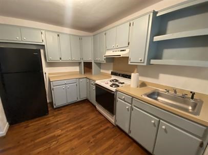 1915 13th Street Columbus, GA 31906 - Photo 5 of 5 a kitchen with a sink a stove and refrigerator