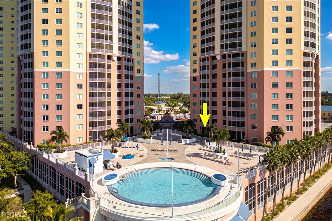 a view of a swimming pool with outdoor seating
