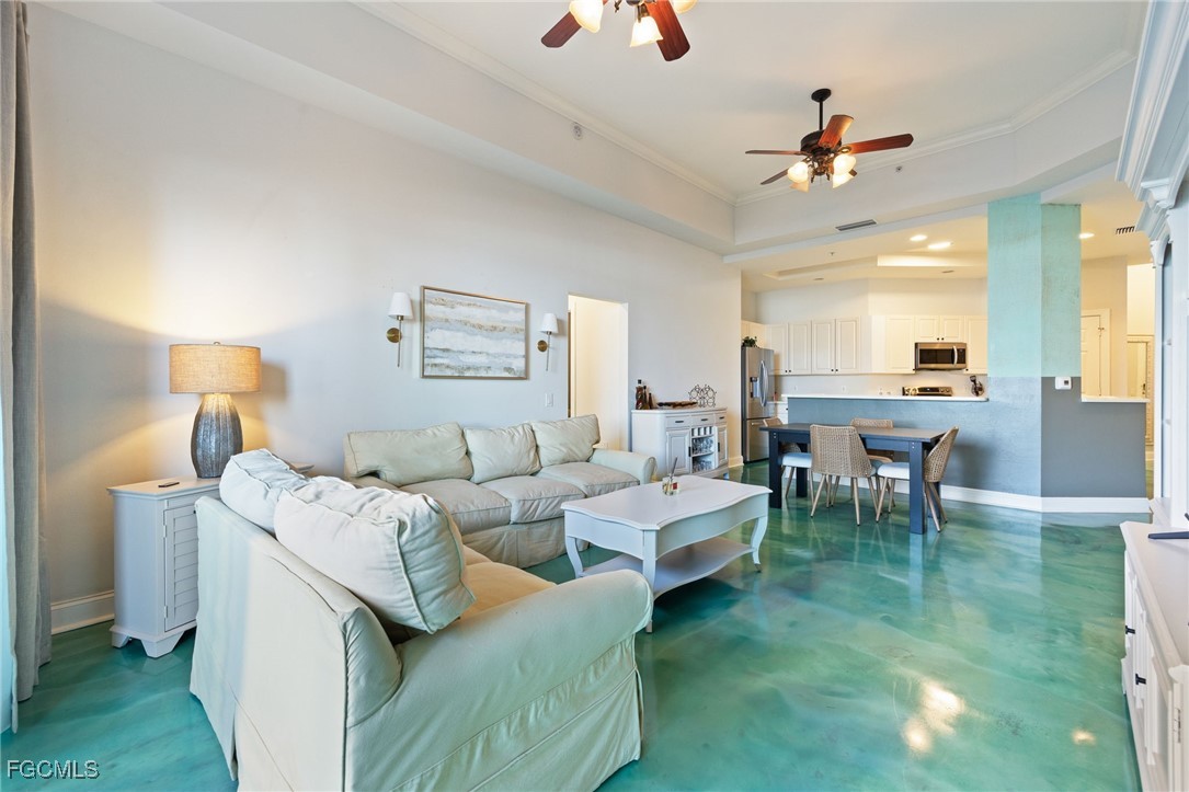 2743 First Street, Unit 304 Fort Myers, FL 33916 - Photo 11 of 50 a living room with lots of furniture and a chandelier