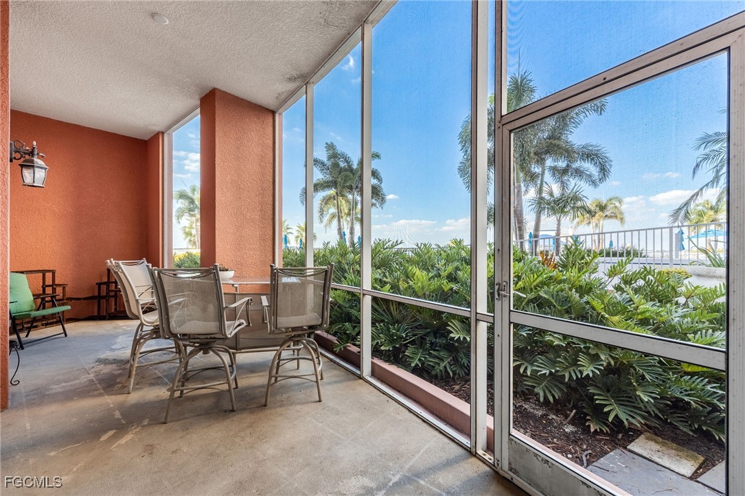 2743 First Street, Unit 304 Fort Myers, FL 33916 - Photo 16 of 50 a view of a room with a furniture and floor to ceiling window