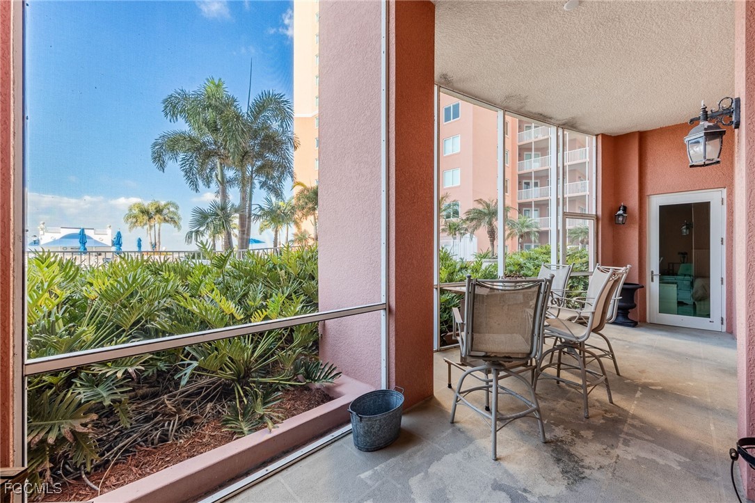 2743 First Street, Unit 304 Fort Myers, FL 33916 - Photo 18 of 50 a view of a chairs and table in the balcony