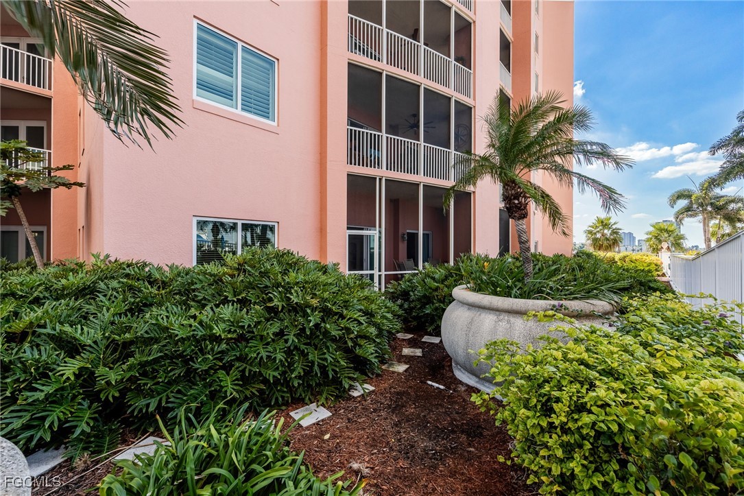 2743 First Street, Unit 304 Fort Myers, FL 33916 - Photo 19 of 50 front view of a house with a yard