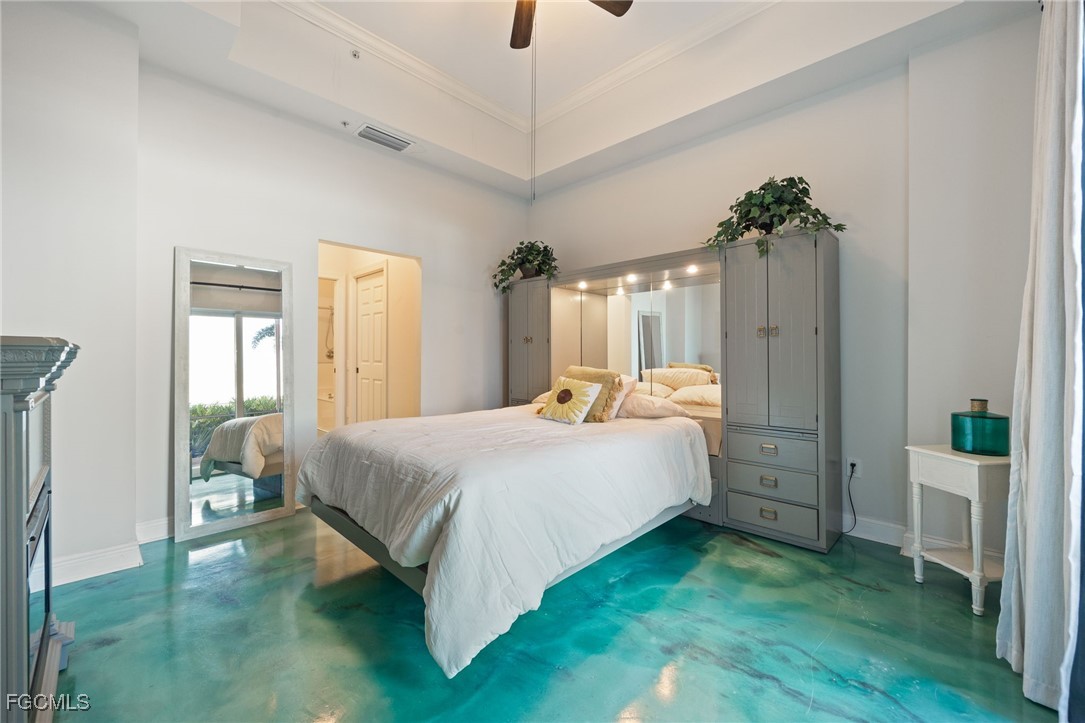 2743 First Street, Unit 304 Fort Myers, FL 33916 - Photo 21 of 50 a spacious bedroom with a bed and a chandelier