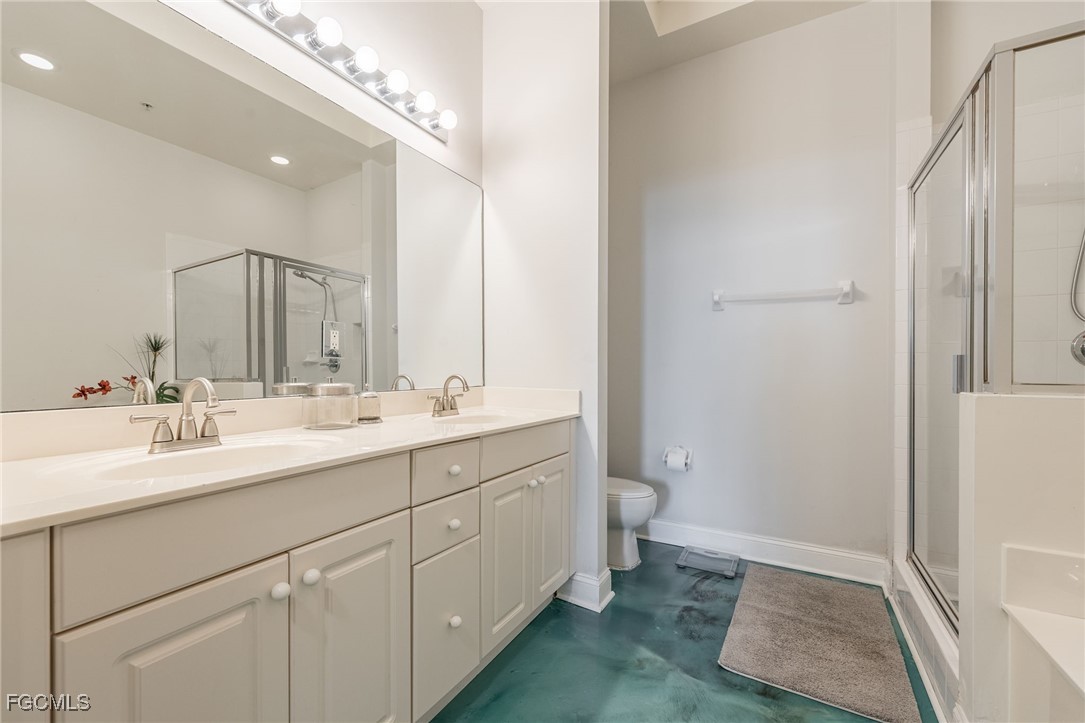 2743 First Street, Unit 304 Fort Myers, FL 33916 - Photo 24 of 50 a bathroom with a double vanity sink and a mirror