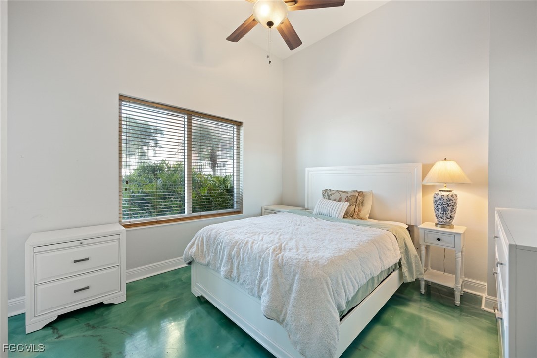2743 First Street, Unit 304 Fort Myers, FL 33916 - Photo 26 of 50 a bedroom with a bed and a window