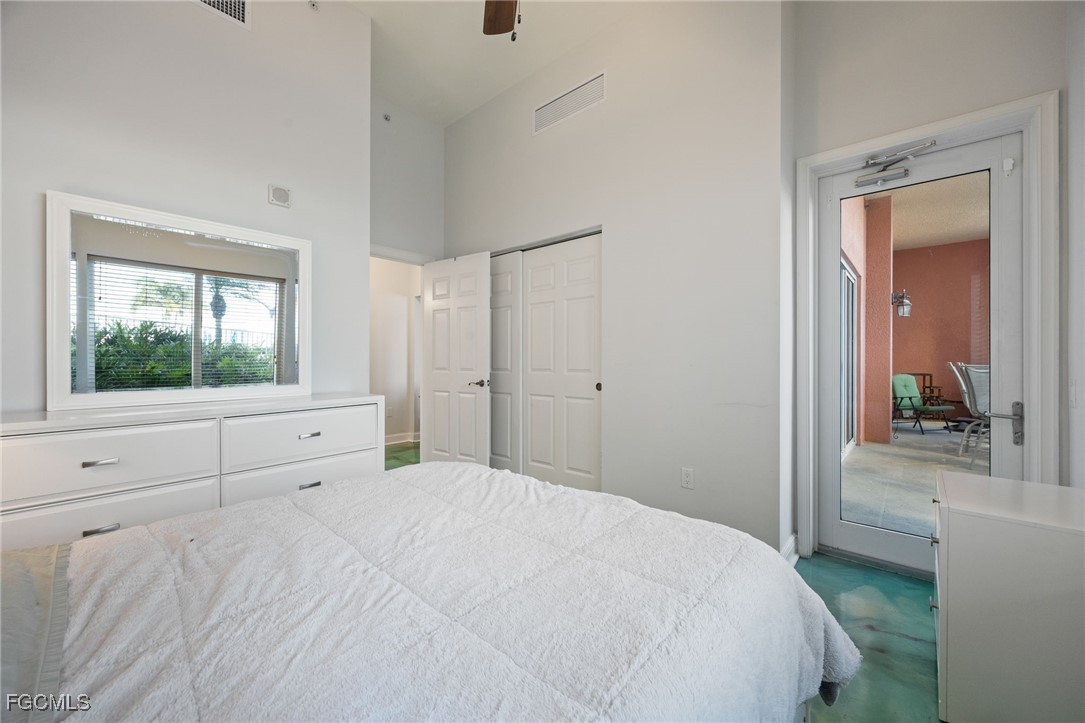 2743 First Street, Unit 304 Fort Myers, FL 33916 - Photo 27 of 50 a bedroom with a bed and a window