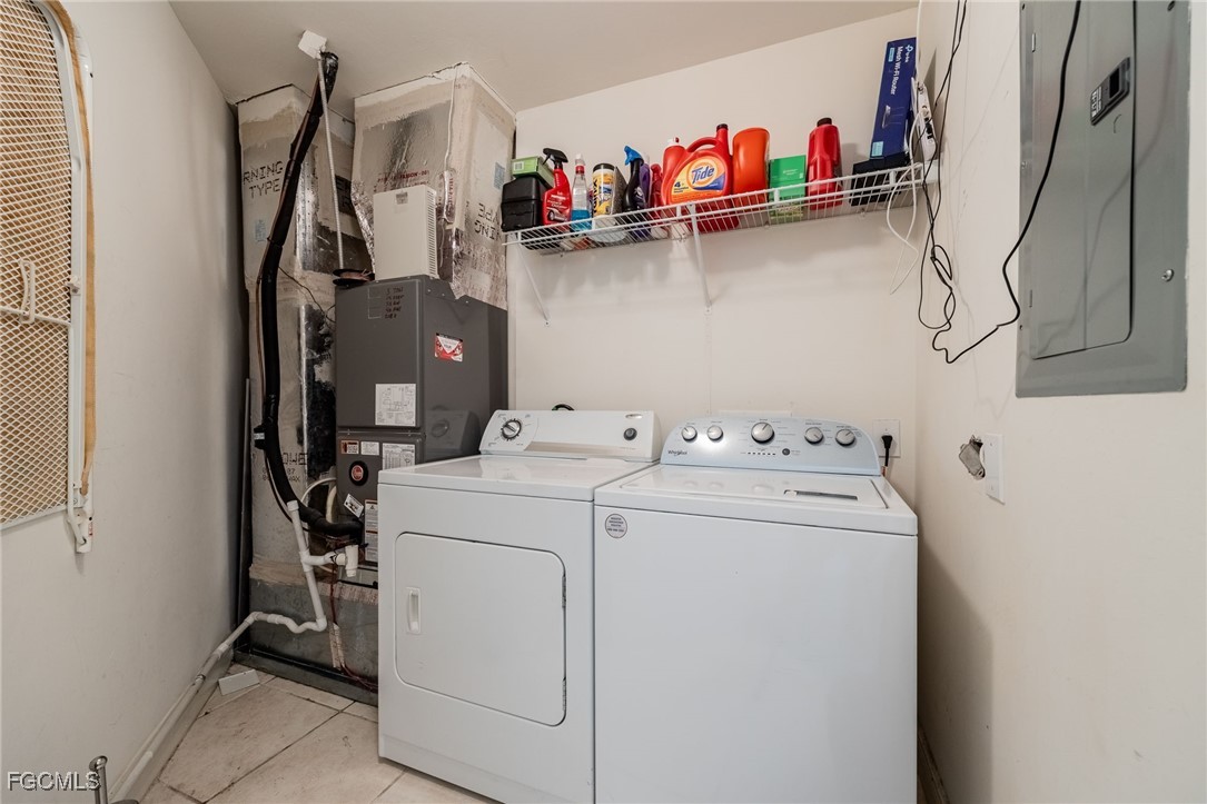 2743 First Street, Unit 304 Fort Myers, FL 33916 - Photo 30 of 50 a utility room with dryer and washer