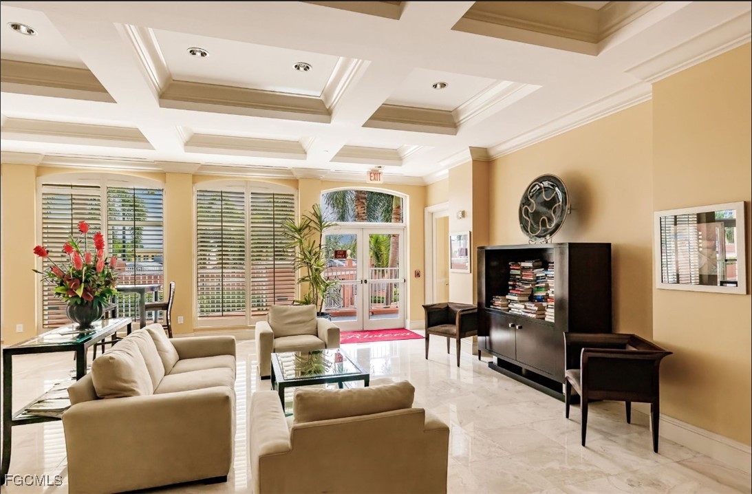 2743 First Street, Unit 304 Fort Myers, FL 33916 - Photo 36 of 50 a living room with furniture and a flat screen tv