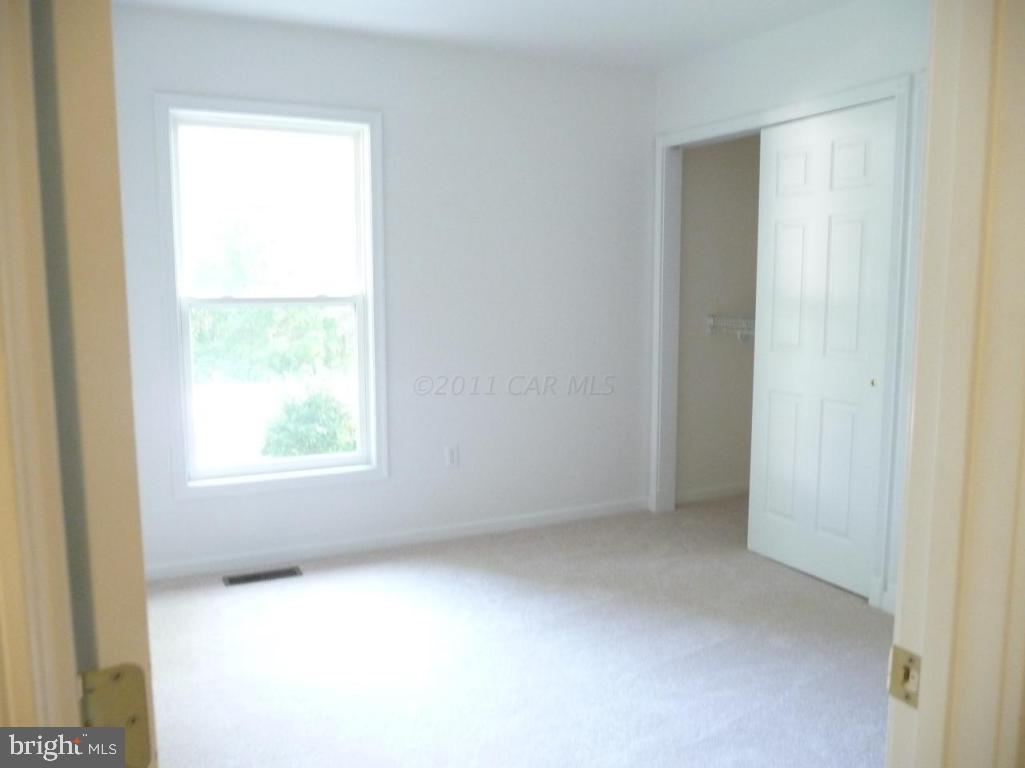 275 Windjammer Road Ocean Pines, MD 21811 - Photo 13 of 20 a view of an empty room with a window
