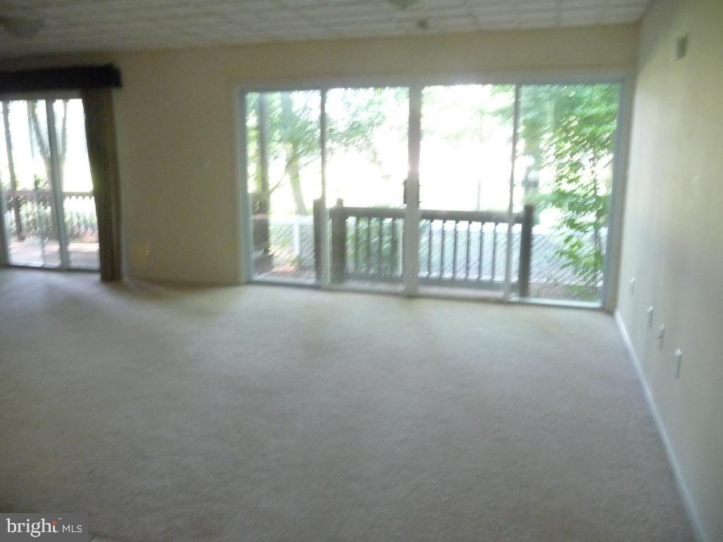275 Windjammer Road Ocean Pines, MD 21811 - Photo 5 of 20 a view of an empty room with a balcony