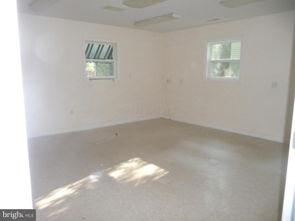275 Windjammer Road Ocean Pines, MD 21811 - Photo 7 of 20 an empty room with windows