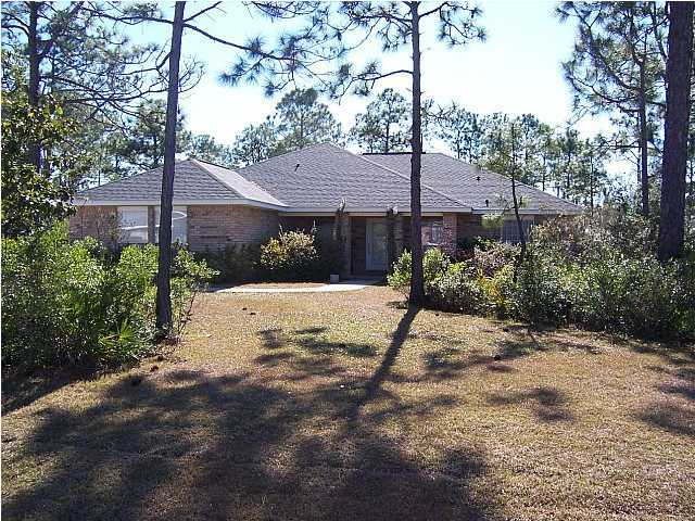 44 Shipwreck Road Santa Rosa Beach, FL 32459 - Photo 1 of 13 a view of a house with a small yard