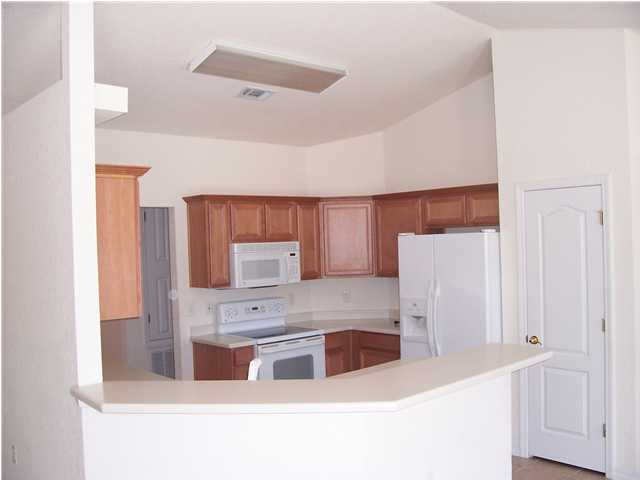 44 Shipwreck Road Santa Rosa Beach, FL 32459 - Photo 4 of 13 a kitchen with stainless steel appliances a microwave a sink and cabinets