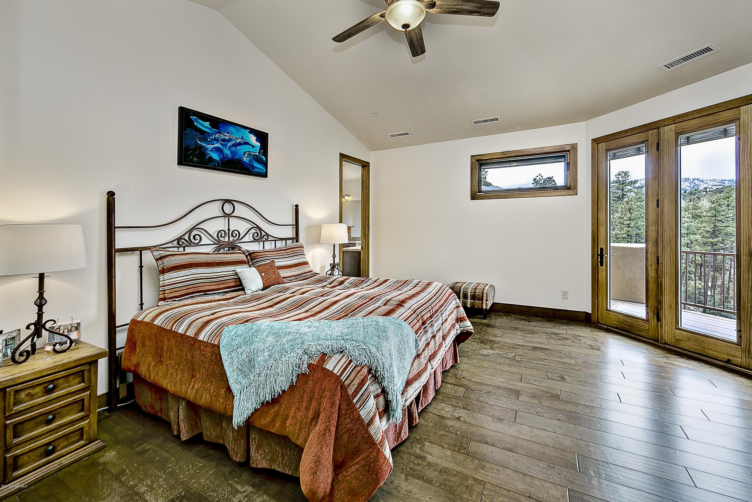 1340 East Valley View Road Prescott, AZ 86303 - Photo 11 of 33 a bedroom with a bed a bookshelf and a window