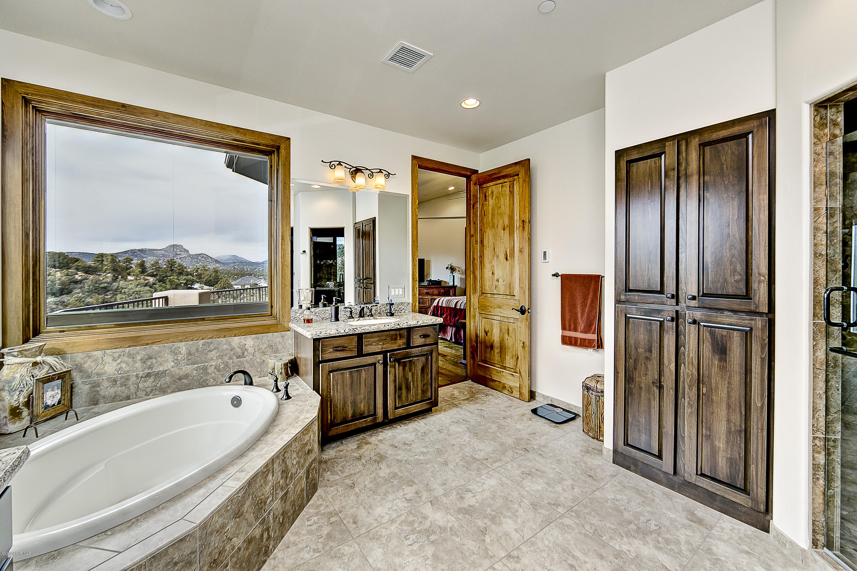 1340 East Valley View Road Prescott, AZ 86303 - Photo 14 of 33 a large spacious bathroom with a tub shower and mirror