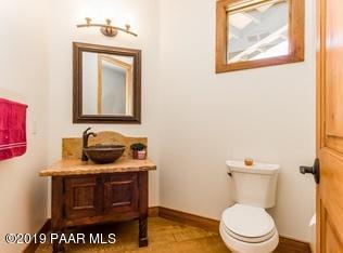 1340 East Valley View Road Prescott, AZ 86303 - Photo 16 of 33 a bathroom with a toilet a sink and mirror