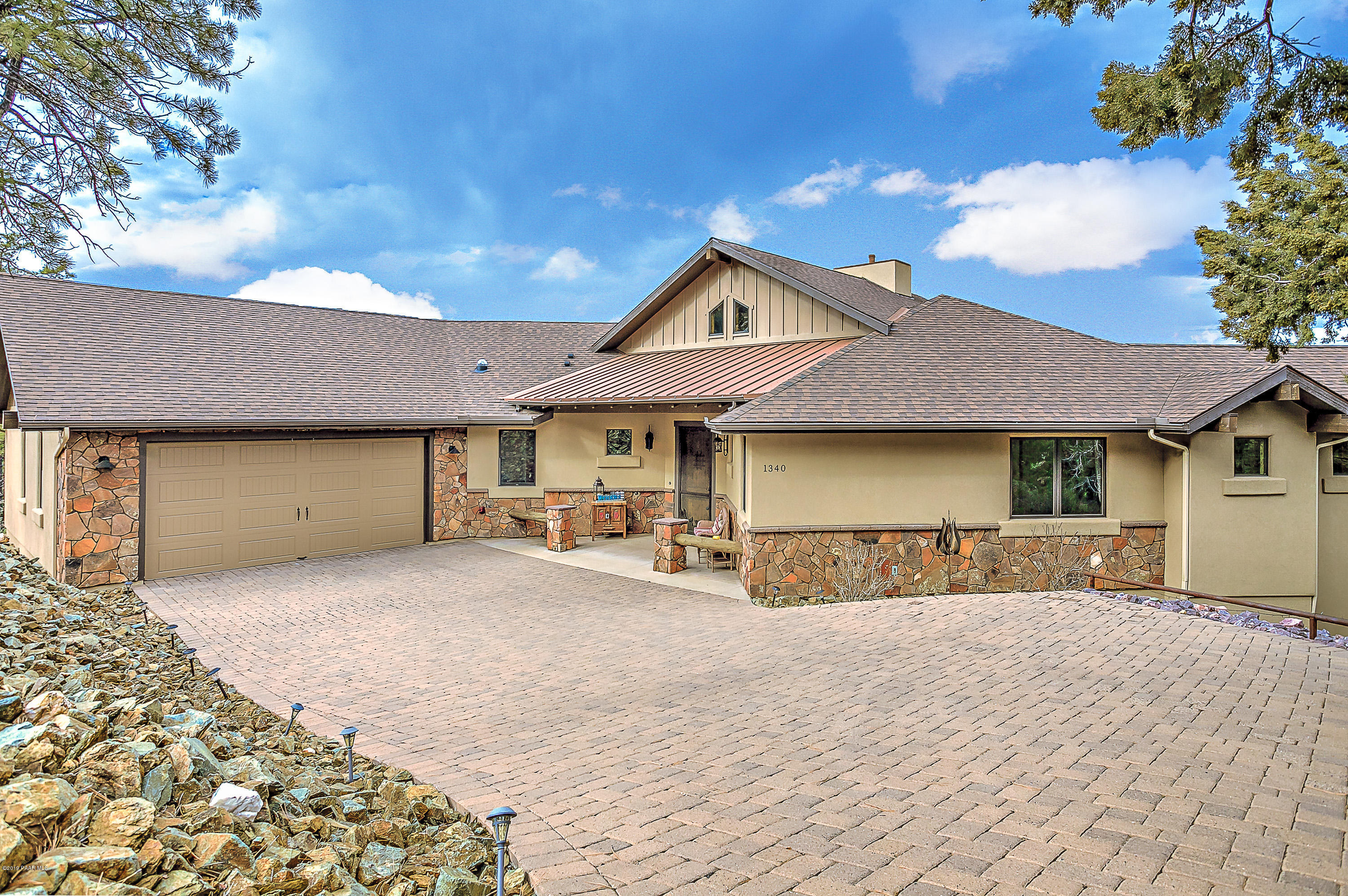 1340 East Valley View Road Prescott, AZ 86303 - Photo 2 of 33 a front view of a house with a yard and garage