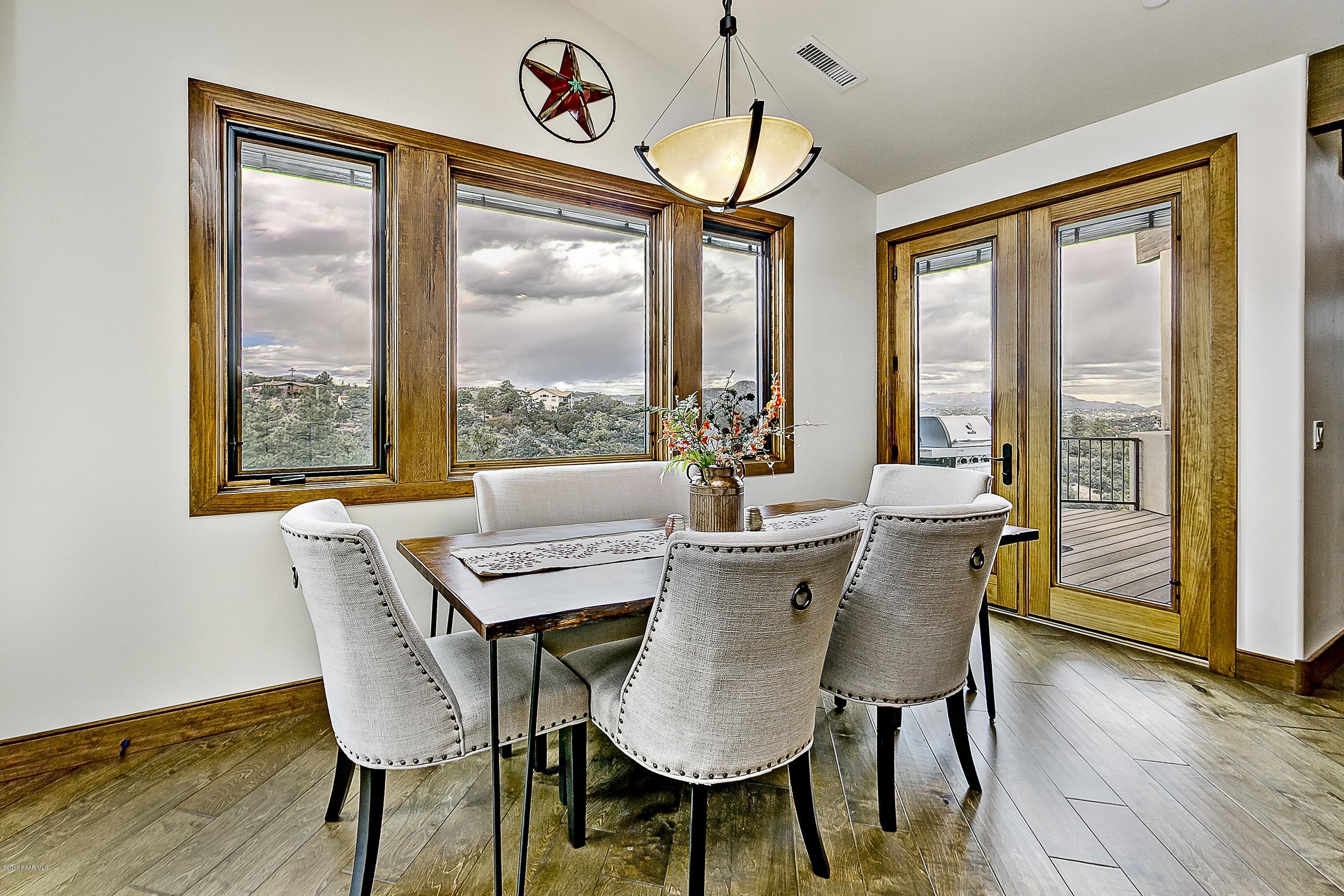 1340 East Valley View Road Prescott, AZ 86303 - Photo 10 of 33 a view of a dining room with furniture window and wooden floor
